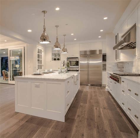 Traditional farmhouse hardwood flooring with wide planks Family Home with New Modern Farmhouse Interiors - Home ...