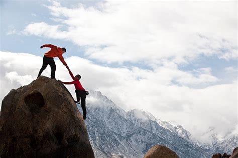 Climbing Mountain Help Stock Photos Pictures And Royalty Free Images