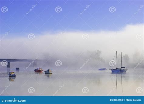 Colorful Boats On A Foggy River Stock Photo Image Of Foggy Boats