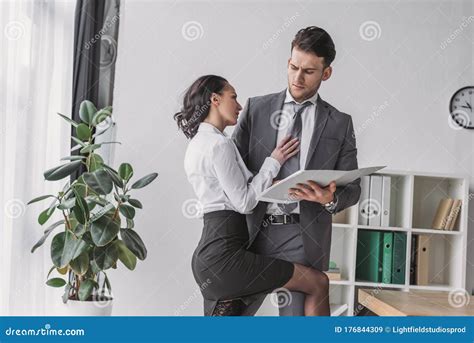 Secretary Touching Businessman While Seducing Him Stock Image Image