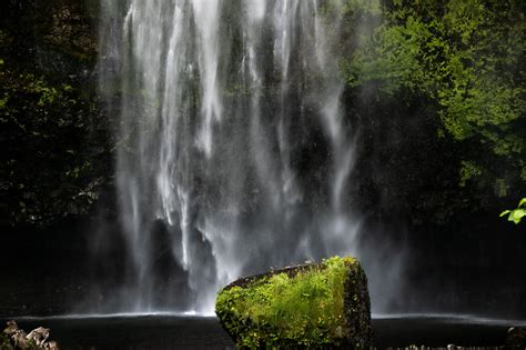 Free Stock Photo Of Misty Thin Waterfall On Mossy Wall