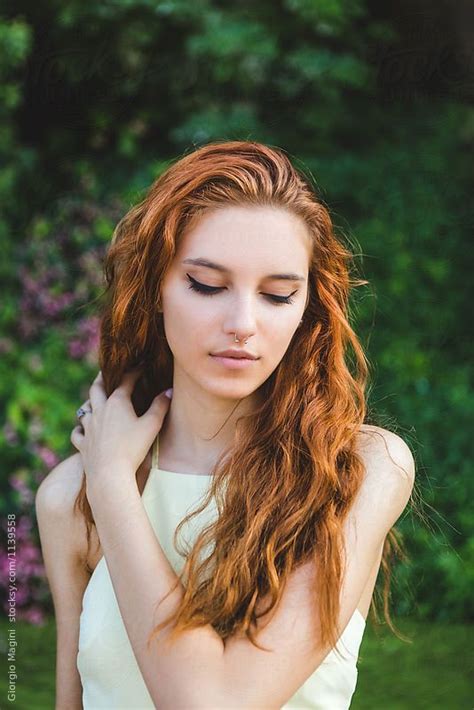 Beautiful Young Redhead Arranging Her Long Hair In A Natural Env By Giorgio Magini Hair