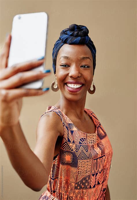 Young African Woman Taking A Selfie By Stocksy Contributor W2