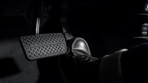 Accelerate And Brake Foot Pressing Foot Pedal Of A Car To Drive Ahead
