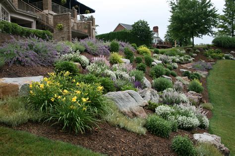 Hillside landscaping is the true challenge that tests the mettle of the creator. Don't know what to do with that hillside? Boulders, along ...