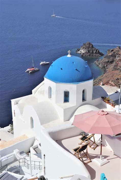 Beautiful Blue Domed And White Buildings In Santorini Greece Stock