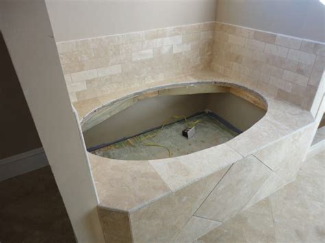 Garden tub 60 x 49 with step 26 deep white center drain. Surround your garden tub with same travertine used in ...