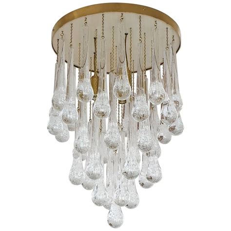 This ceiling light fixture uses three italian metallic glass pendant | copper gold chrome murano glass light. Mid-Century Modern Brass and Murano Clear Glass Drops ...
