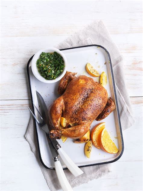 Roasting the chicken in a cast iron skillet at a high heat ensures a crispy skin that seals in the juices in only 40 minutes. Spiced Roast Chicken with Orange-Cilantro Chimichurri ...