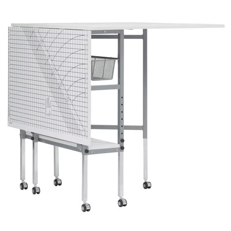 The white sewing table from home decorators collection provides all the sewing space you need in one compact piece. Sew Ready 58 in. W x 36 in. D MDF Folding Fabric Cutting ...