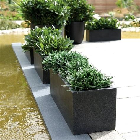 Commercial planters help spruce up indoor and outdoor spaces with natural pops of color and life. Cadix Black Low Rectangular Planters | Modern Planters ...