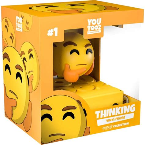 A Yellow Box With An Emoticive Face In The Front And Behind It That