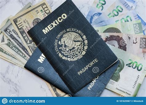 High Angle View Of Two Mexican Passports On Dollars And Pesos On The Table Under The Lights