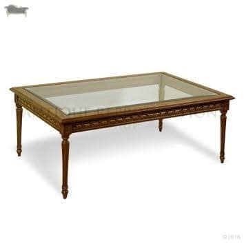 The circular top with a raised edge and inset marble top, the apron with fluting and raised on circular fluted legs ending in brass casters. Louis XVI Coffee Table with Glass - Antique Reproduction Shop