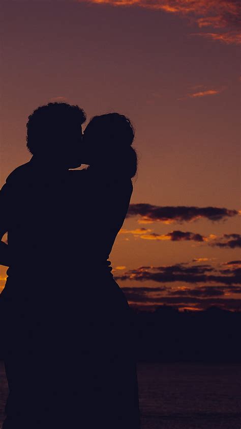 couple in love kissing sunset hd phone wallpaper peakpx