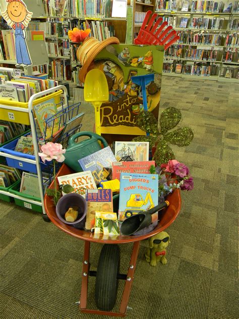 dig into reading summer reading program display lake benton library books and garden tools in a
