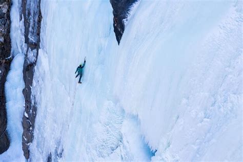 Premium Photo Ice Climbing On Frozen Waterfall Aerial View