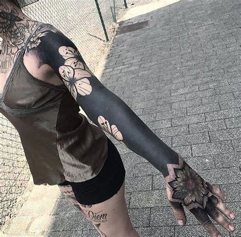 These Striking Solid Black Tattoos Will Make You Want To Go All In