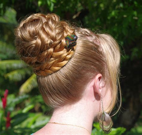 Braids & hairstyles for super long hair: bohemian herringbone braid bun