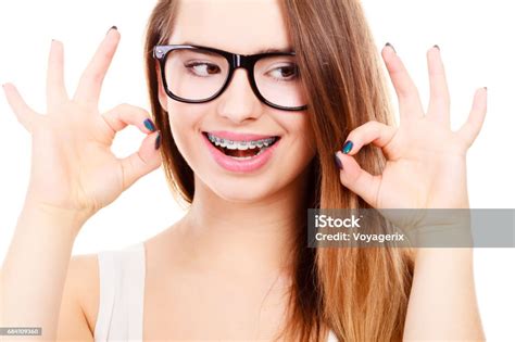 Happy Nerdy Teenage With Brace Wearing Eyeglasses Stock Photo