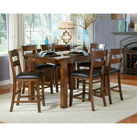 Wood surface is textured for a great rustic feel. A-America Mariposa Gathering Counter Height Dining Table ...