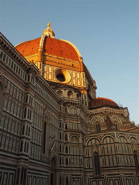 The exterior of the basilica is faced with polychrome marble panels in various shades of green and pink, bordered by white, and. The Florence Cathedral or Il Duomo di Firenze in Florence ...
