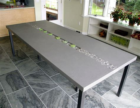 We just had to make one, seeing that we have an old sewing machine leg just lying around begging to be used. Concrete Rock Dining Table by Trueform Concrete ...