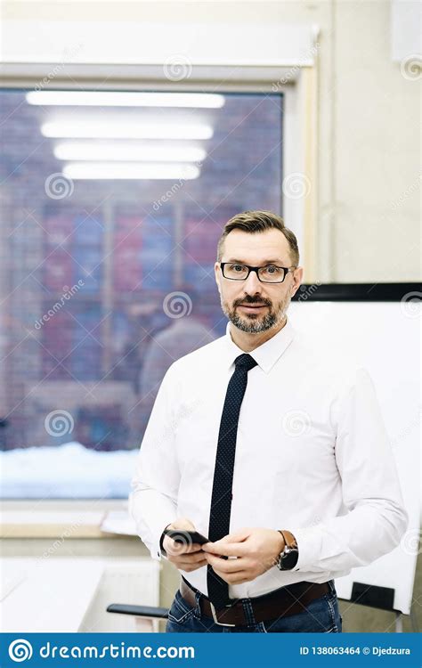 Middle Aged Handsome Manager Businessman In White Shirt At Office Stock