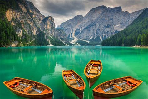 Beautiful Mountain Lake With Wooden Boats In The Dolomitesitaly Stock