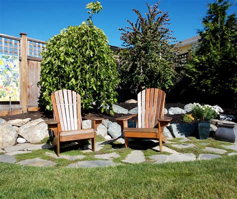 Pebbles and square cut stone in unison. Outdoor resting area well marked by the stone floor ...