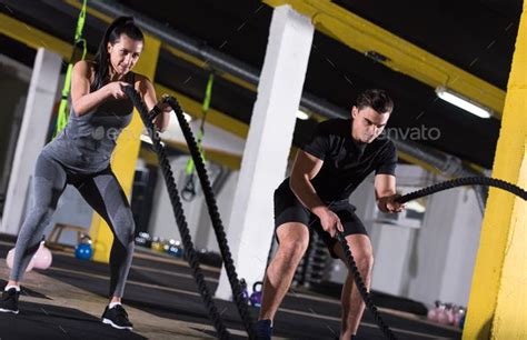 Sports Couple Doing Battle Ropes Cross Fitness Exercise Sports