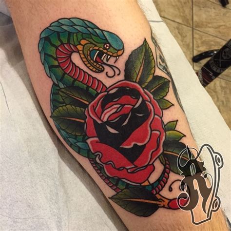 Learn more about the symbolical meaning of the snake although, for some people the image of the snake associates with scary things. ryantattooer:snake-bite-snake-rose-traditional-color-bold-leg