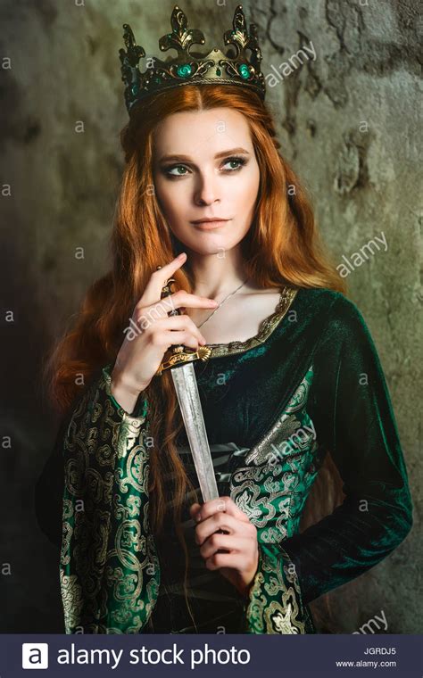 Red Haired Woman In A Green Medieval Dress Near The Castle