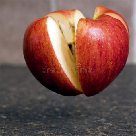 Apple Being Cut In Half Stock Photo Image Of Apple Kitchen 18936022