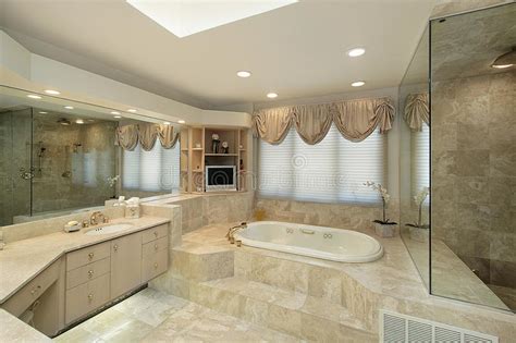 A bathtub can be made accessible for some people by the addition of grab bars or hand grips, or through the use of lifts that lower and raise the bather in the water. Master Bath With Step Up Tub Stock Photo - Image of ...