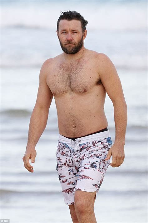 joel edgerton shirtless as he strips down to swimming trunks at bondi beach daily mail online