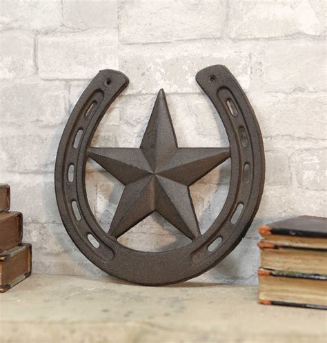 With a length span of over 5 feet this statement wall art will become the focal point of any indoor or outdoor space. 10"W Rustic Cast Iron Cowboy Horseshoe With Western Star ...