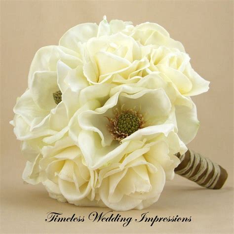 Ivy and clematis bouquet with blue silk wrap. Magnolia & White Rose Bouquet | Ivory wedding flowers ...