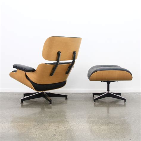 Soft pad black leather aluminum group chair, designed by charles and ray eames for herman miller, american, circa 1960s. Black leather & oak veneer Eames lounge chair + ottoman ...