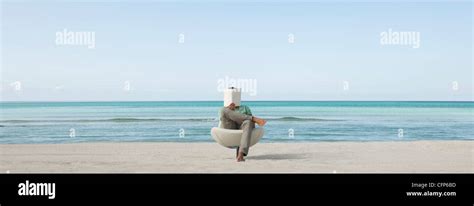Man Reading Book At The Beach Stock Photo Alamy