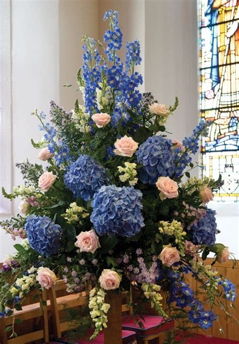 Use pedestals (commonly provided by the church) to elevate the arrangement if more height is desired. large flower arrangements for church | and creative flower ...