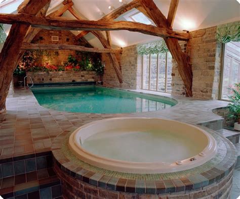 This indoor swimming pool is specially designed with a large glass in front of it. Traditional home plans with beautiful indoor #swimming # ...