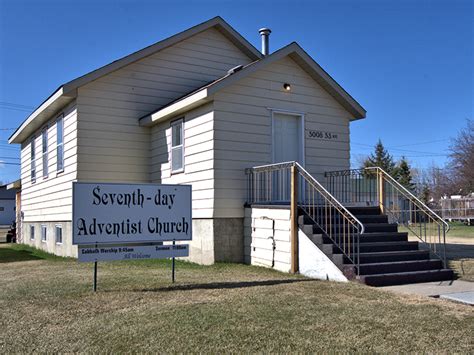 The church is cream coloured with white borders at the edges and windows. Seventh Day Adventist Church - Town of Bonnyville