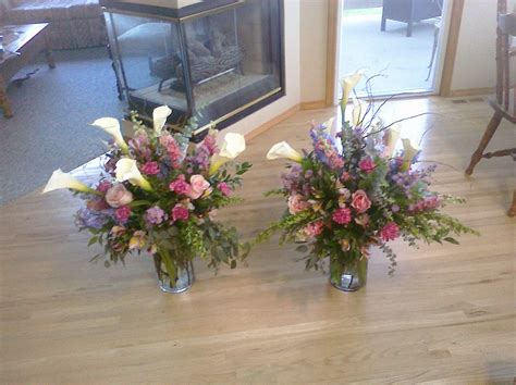 On a funeral in vietnam everybody is dressed in white. Flower arrangements for a funeral. Wildflower/Pastel ...