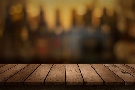 Premium Photo Wooden Table With A View Of Blurred Beverages Bar