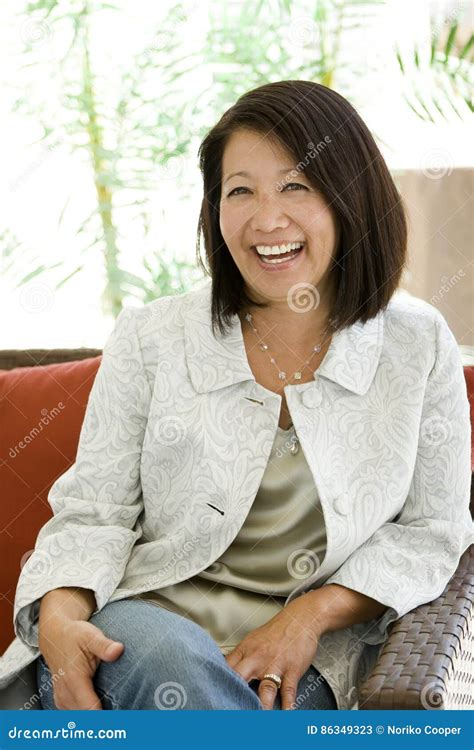 beautiful mature confident asian woman smiling stock image image of cheerful portrait 86349323