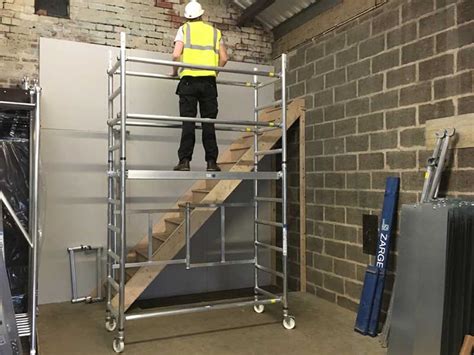 Scaffolds with a height to base width ratio of more than 3:1 must be restrained from tipping over by guying, tying, or bracing. Reachmaster mobile scaffold tower indoor 3.7m working ...