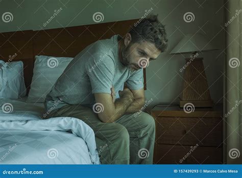 Dramatic Lifestyle Portrait Of Handsome Guy Sitting On Bed Feeli Stock Image Image Of Anxiety