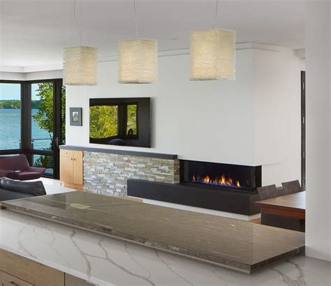 Instead of a wall separating the master bedroom from the bath, imagine a wall of gentle flames, their glow enhancing a soft white interior. 8 Tips for Breaking Up a Large Wall with a Linear Fireplace