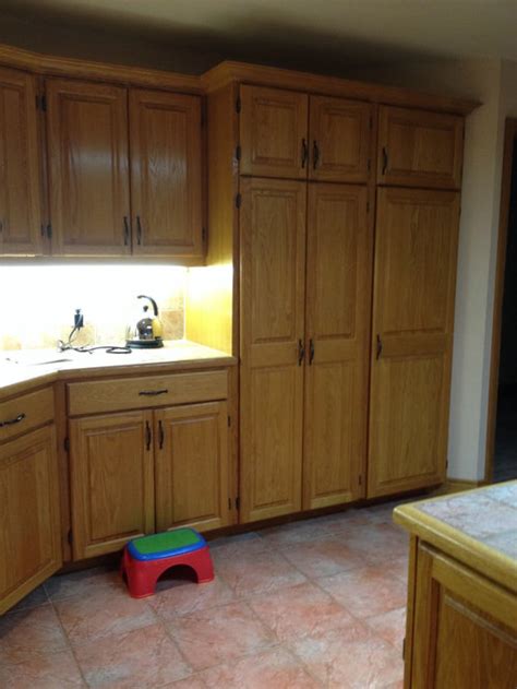 Restore dry and damaged wood kitchen cabinets, water damage, steam damage. Restaining cabinets